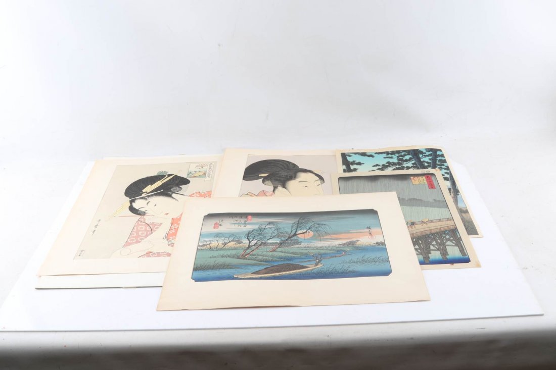 WOODBLOCK PRINTS UTAMARO HOKUSAI HIROSHIGE: Kitigawa Utamaro woodblock print of a woman holding a scroll and calligraphy brush. Measures 18 inches by 14.25 inches. Kitigawa Utamaro woodblock print of a woman holding a scroll. Measures 18 inches