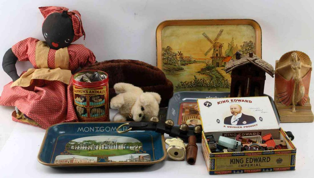 TOPSY TURVY DOLL TOY CARS ART DECO CONFEDERACY: Useful lot to include Lesney and other make toy cars, duck call. Mammy pepper, Topsy Turvy doll, Lucky Strike cigarette tin, signed and dated reverse C 1939 N.A.S, art deco bookend, 3 vintage trays in
