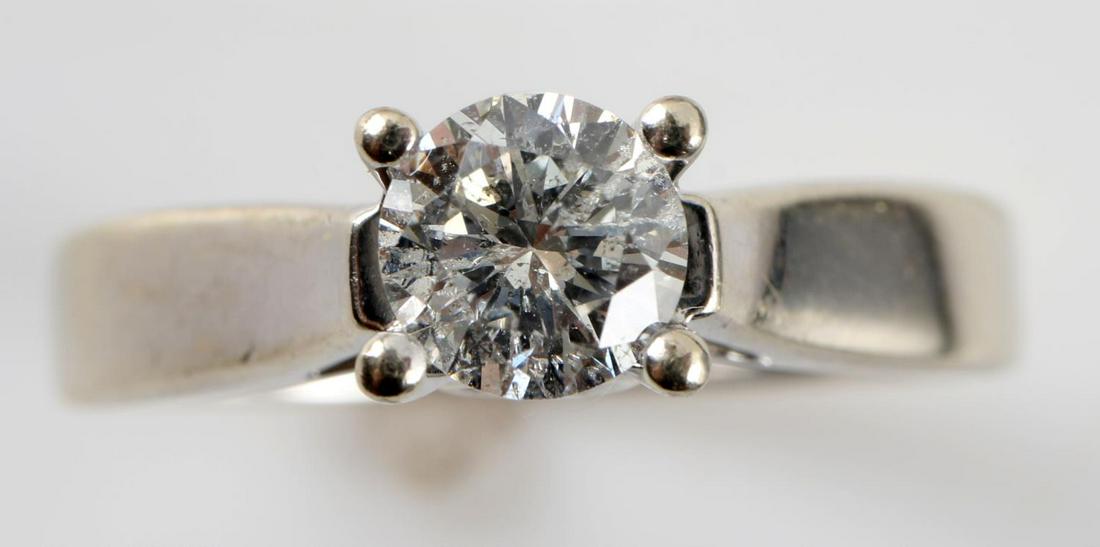 14K WHITE GOLD DIAMOND ENGAGEMENT RING TCW .86: Zales 14k white gold diamond solitaire with accent diamonds engagement ring. Solitaire is a .74 carat round cut. Diamonds on gallery are each .06 carat and round cut. Color: H - J. Clarity: VS1-VS2. 4