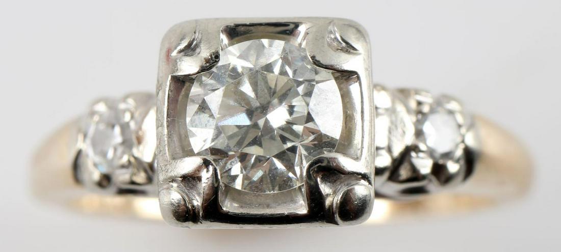 14K YELLOW & WHITE GOLD DIAMOND RING .5 TCW: 14k yellow gold band. Stones mounted at top in 14k white gold. Solitaire with accent diamonds. Solitaire diamond is .44 carats. Each accent diamond is .03 carats. Clarity: VVS2 Color: H-I. Size: 5.5 2