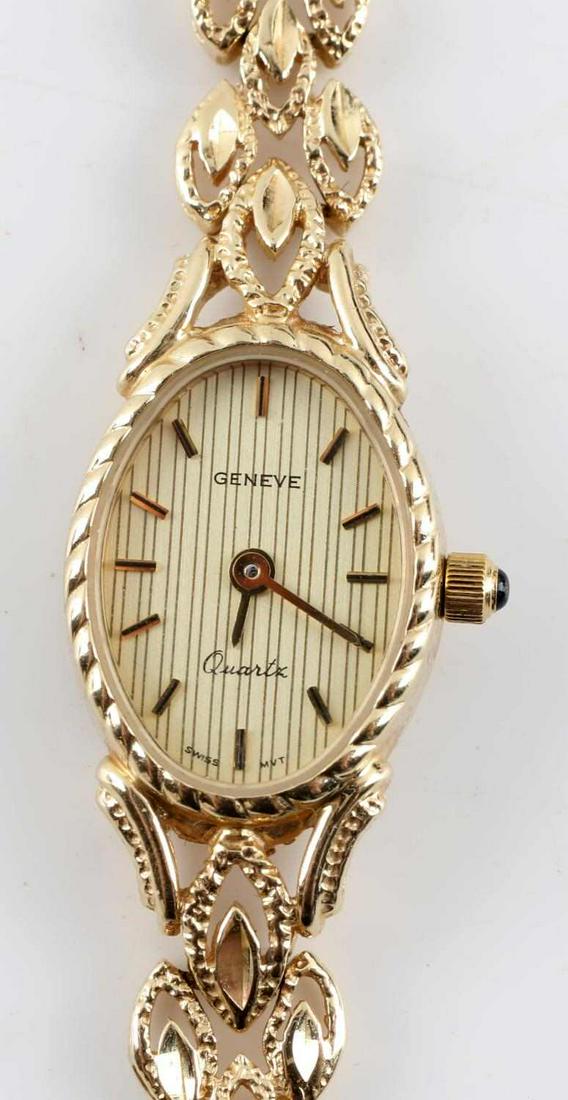 LADIES MQ GENEVE QUARTZ AUTOMATIC 14K GOLD: Ladies MQ wristwatch. Face is marked "Geneve Quartz Swiss Mvt". Back of the case is marked "14k" at the bottom and "MQ" at the top. Watch band clasp is marked "14KP" and have the same "MQ" maker mark 