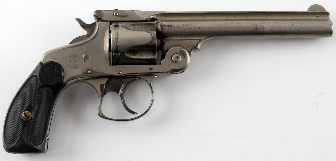 SMITH AND WESSON 38 MODEL 4 DOUBLE ACTION REVOLVER: Smith and Wesson .38 model 4 revolver. Made in Springfield. Patent year 1889. Top break with a 5" barrel and a 5 round cylinder. Good conditon for its age. Some pitting, patina, and small sections of