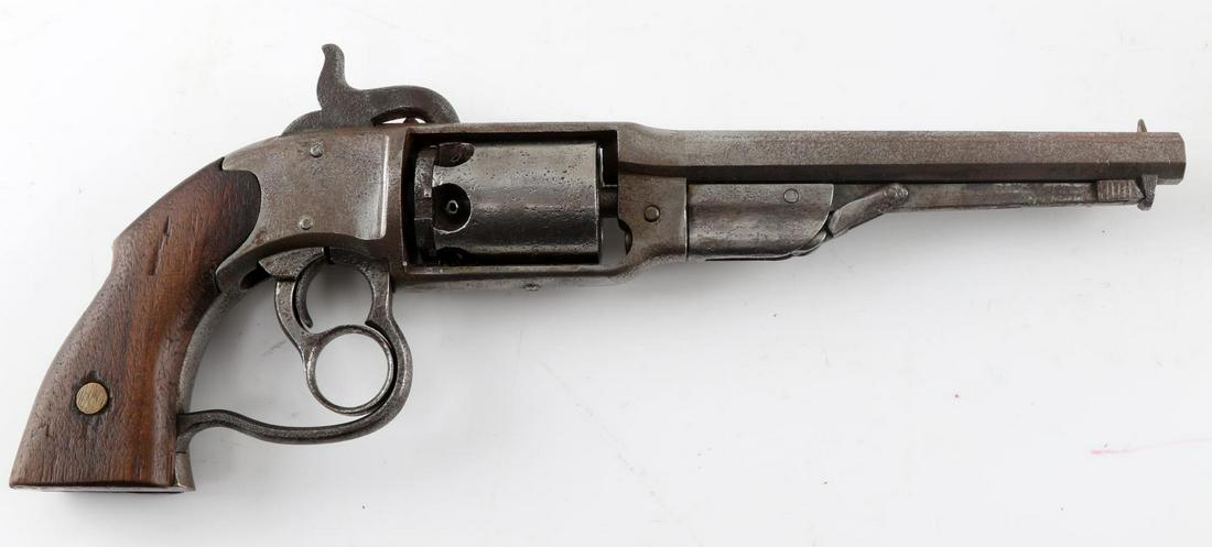 SAVAGE NEW MODEL 1860 PERCUSSION REVOLVER .36 CAL: Savage cap and ball revolver with the unique figure eight double trigger. The various metal pieces show minor pitting. The bore shows corrosion and darkening. The wood of the grips have minor surface 