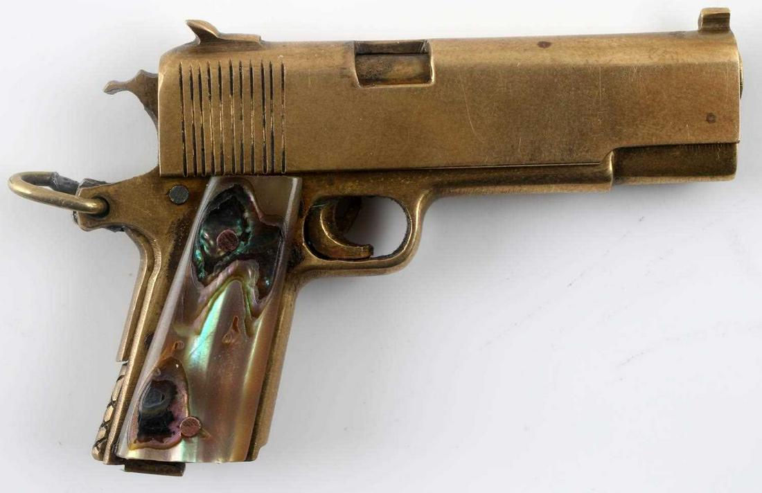 MINIATURE COLT 1911 1/4 TOM WESTON MODEL PISTOL: 1/4 scale miniature of a Colt 1911 pistol crafted by Tom P. Weston of Mexico City, Mexico. Made somewhere within the late 1940s to mid 1960s. 2 5/16 inches long with a 1 3/16 inch barrel of about .124