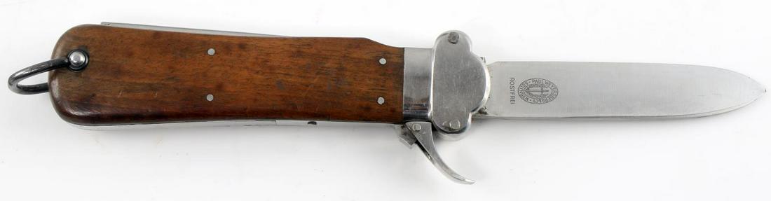 WWII GERMAN THIRD REICH PARATROOPER GRAVITY KNIFE: German Luftwaffe Fallschirmjager-Messer Type II FKm gravity knife with beechwood handle. Blade is marked "Paul Weyersberg & Co. Solingen." Bottom of release button is marked "3." This version has the 