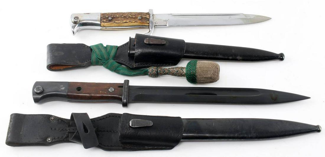 WWII GERMAN THIRD REICH DRESS BAYONET LOT OF 2: This lot includes 2 German Heer Dress bayonets. 1 is a stag handled and is unmarked (perhaps made for export) and includes portepee. The other is marked "3913" over "d" on its ricasso, marked "5777" o