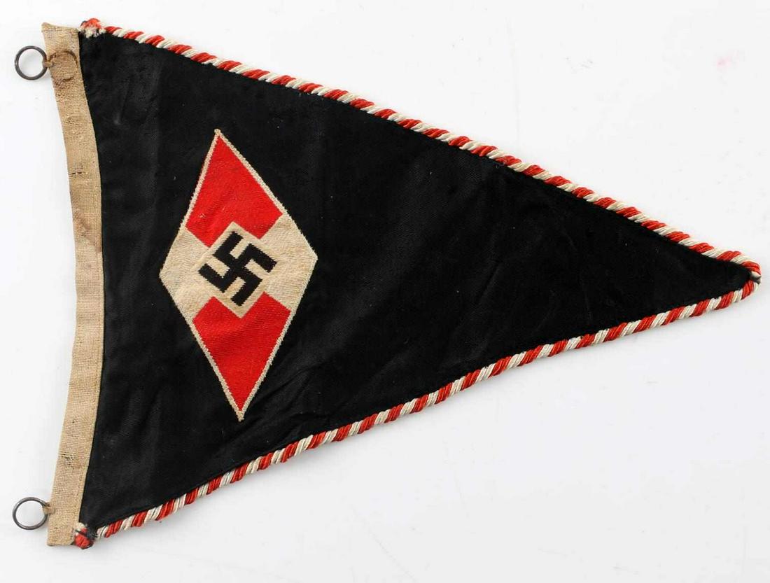 WWII GERMAN 3RD REICH HITLER YOUTH PENNANT FLAG: German Hitler Youth pennant. Double sided with twisted cord piping. Measures 9" X 7.25". Heavily worn RZM tag still present at corner. Good condition with some staining and fading present. Does not fl
