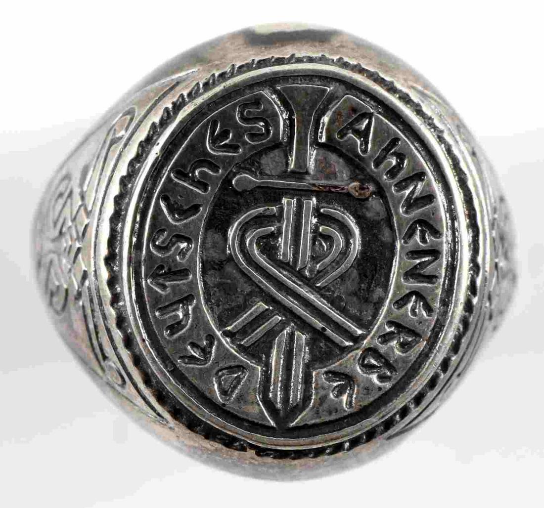 WWII GERMAN SS AHNENERBE SOCIETY SILVER RING: German SS Ahnenerbe society silver ring. Marked 800 silver on the reverse of band. Etched "Deutsches Ahnenerbe" at front with sun wheel swastikas at the sides. Very good condition overall. Some silver
