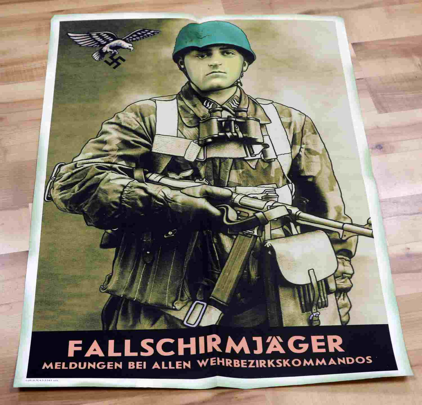 LUFTWAFFE PARATROOPER FALLSCHIRMJAGER POSTER: German WWII Luftwaffe Paratrooper Fallschirmjager Recruiting Poster. Measures 23 inches by 33 inches. The front shows a Paratrooper dressed in full combat gear carrying an MP40 machine gun. The base r