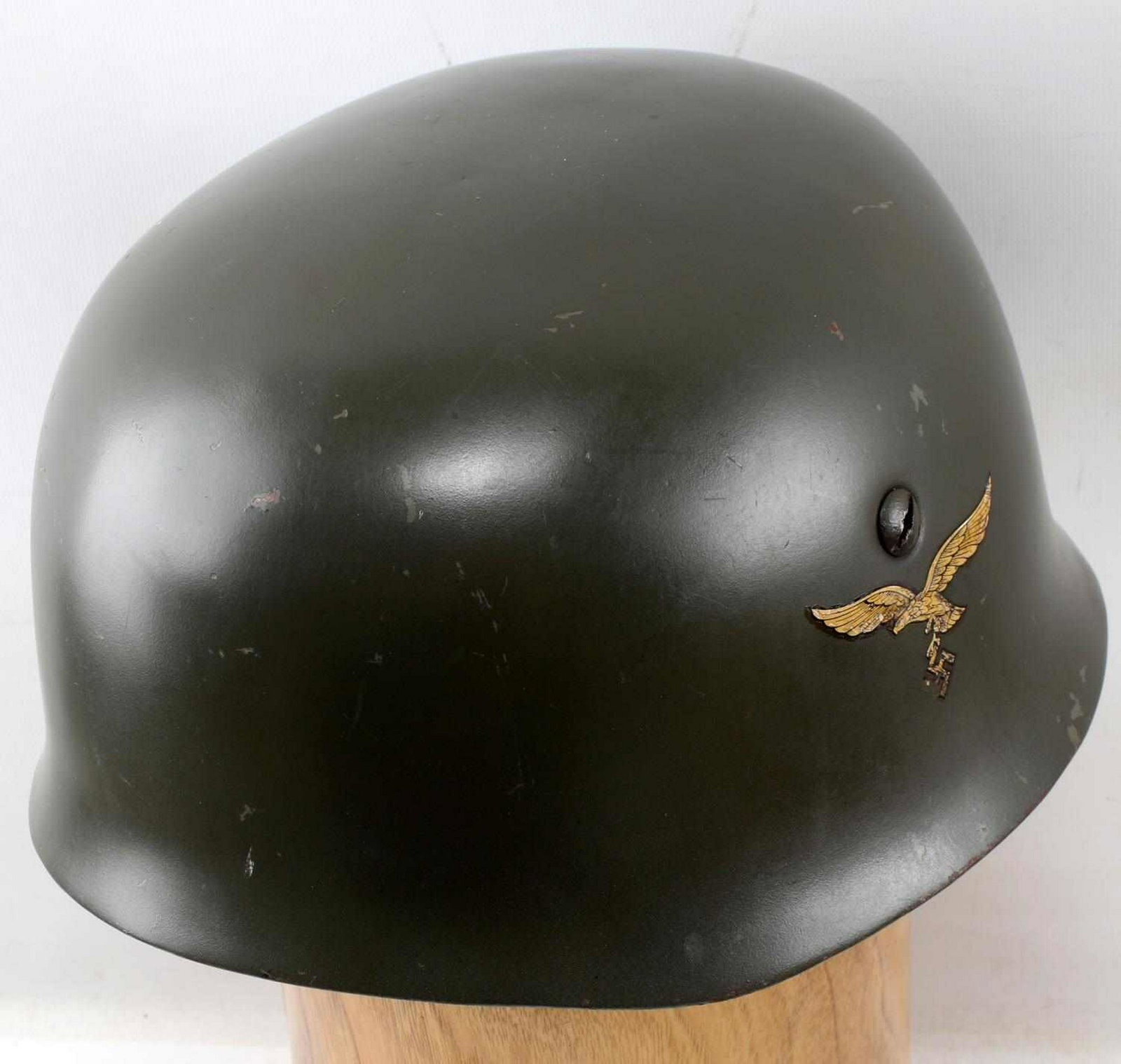 WWII GERMAN LUFTWAFFE DBL DECAL PARATROOPER HELMET: Paratrooper Fallschirmjager jump helmet. Green painted steel body, Luftwaffe eagle decal on left side and national colors decal on right side (some loss). Includes brown leather liner and pads with me