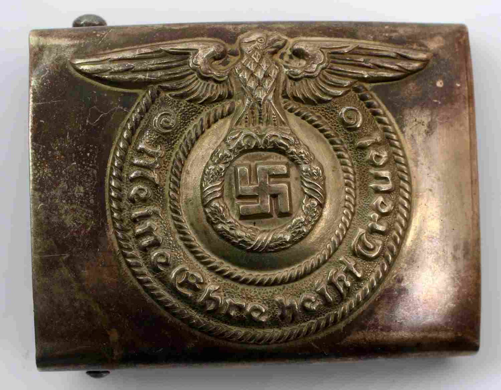 WWII GERMAN THIRD REICH SS ENLISTED BELT BUCKLE: German SS EM belt buckle. Maker marked "O & C ges gesch." on reverse. Stamped nickel construction. Very good condition overall with some patina and slight signs of abrasions present. Unauthenticated; 