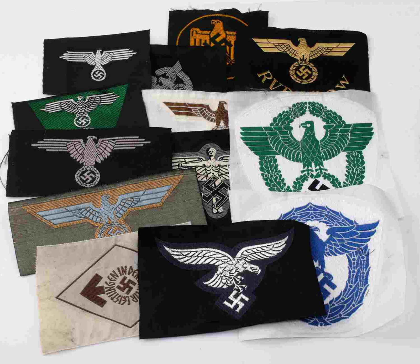 WWII GERMAN THIRD REICH CLOTH INSIGNIA PATCH GROUP: Group of 13 WWII German military patches. Includes Waffen SS, SS Police, Coastal Artillery, Afrika Korps, Sports, NSFK glider corps, Hitler Youth, Luftwaffe, Railway, and Police. Includes breast eagle