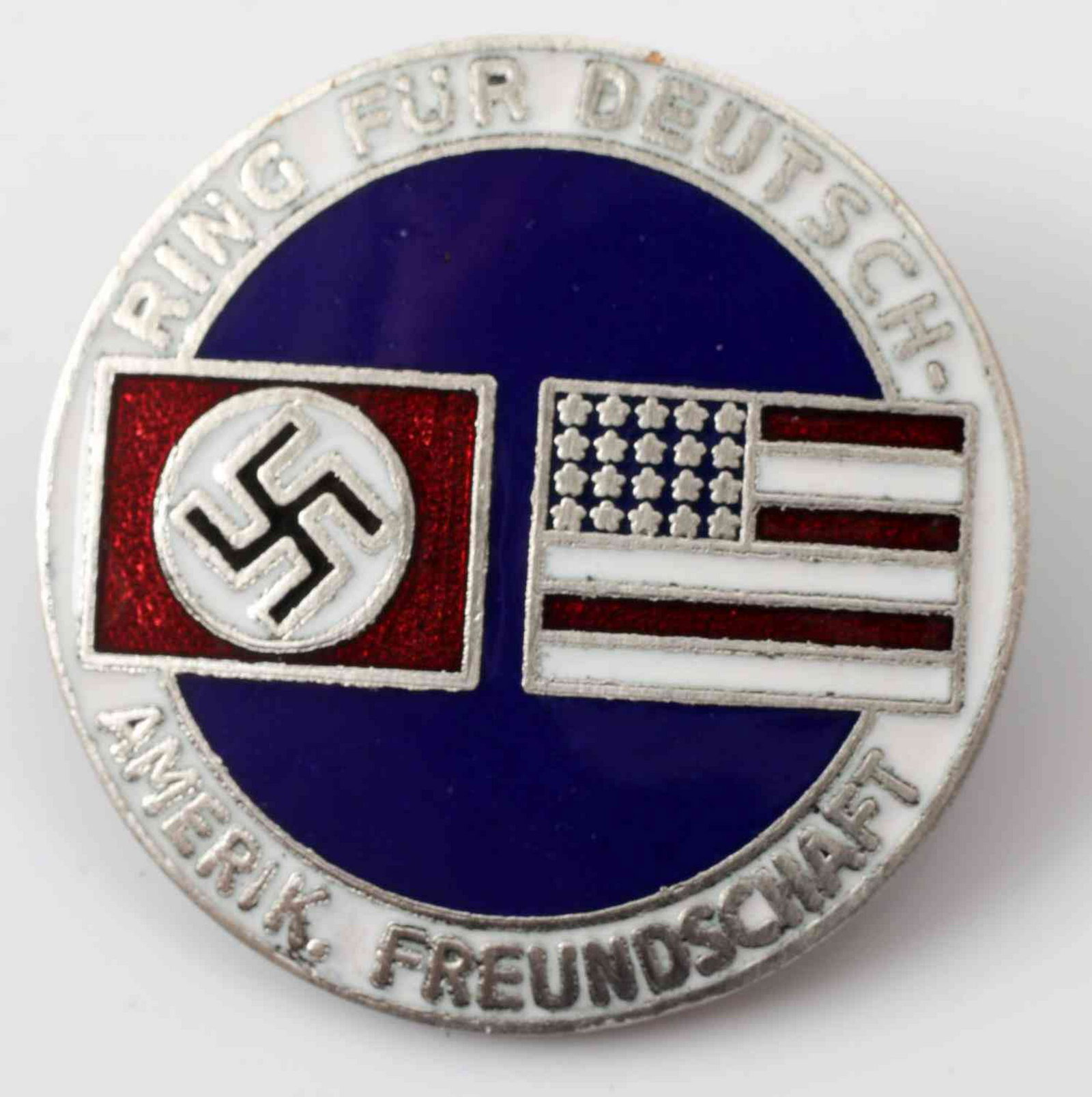 WWII GERMAN THIRD REICH AMERICAN BUND PARTY BADGE: German American Bund Party Badge. Measures 1 1/16 inches in diameter. The reverse is maker marked 'CTD'. Has a thin horizontal safety pin back. Nickel construction with enamel. In very good condition.