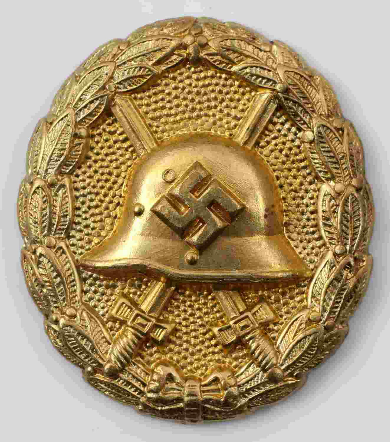 WWII GERMAN GOLD CONDOR LEGION WOUND BADGE: German Condor Legion wound badge in gold. Stamped brass construction. Awarded for receiving 5+ wounds in the Spanish Civil War. Missing pin back and catch. Excellent condition with this exception. Una