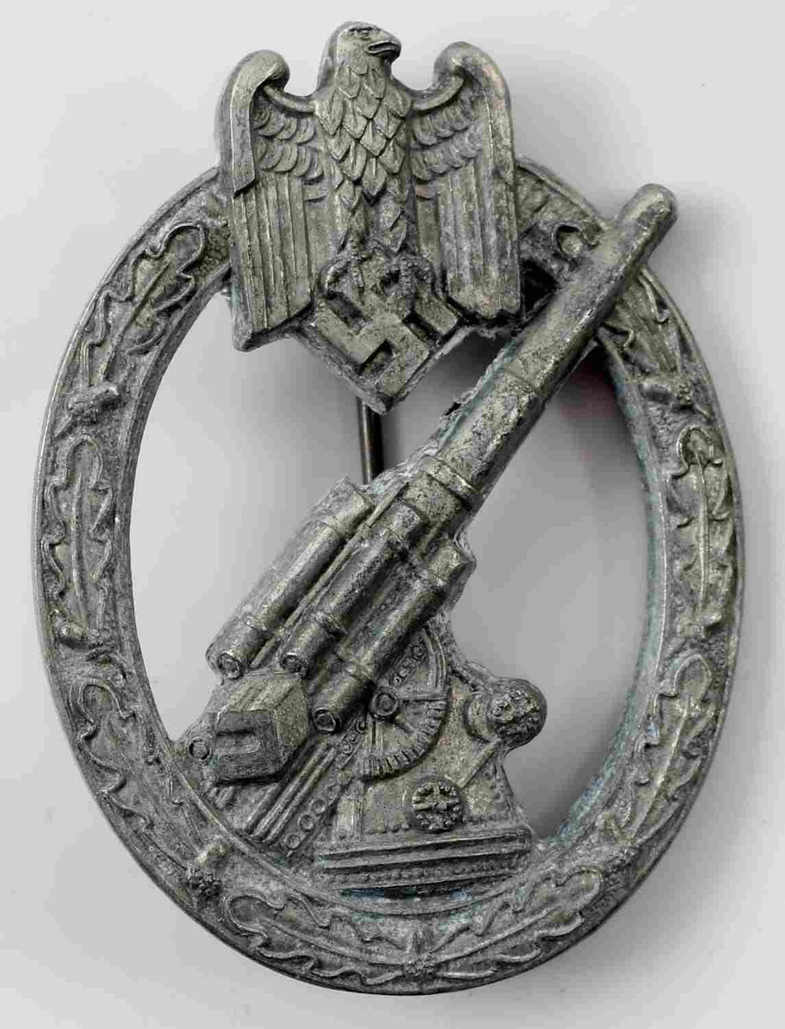 WWII GERMAN ARMY HEER FLAK ANTI AIRCRAFT BADGE: German Heer Anti Aircraft badge. Reverse maker marked "HA" for Hermann Aurich. Has a thin vertical pin back. Solid back nickel construction. Very good overall with some patina present. Unauthenticated