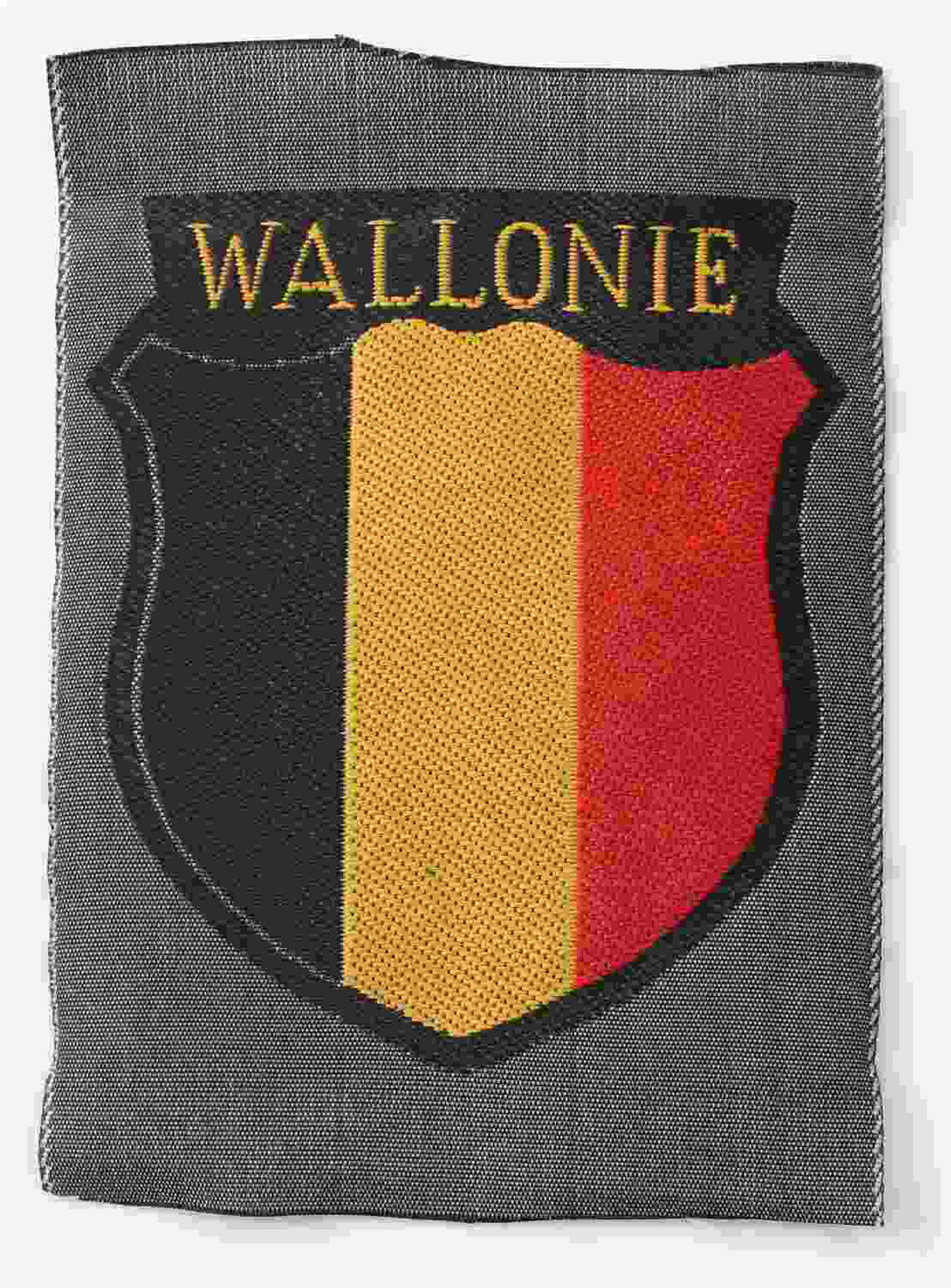 WWII GERMAN THIRD REICH SS WOLLONIE SLEEVE PATCH: Sleeve patch for the SS volunteer Walloon Legion. Measures 2 5/8 inches wide by 3 5/8 inches high. Machine embroidered bevo cloth construction. In very good condition. Unauthenticated/Sold 'as is'.