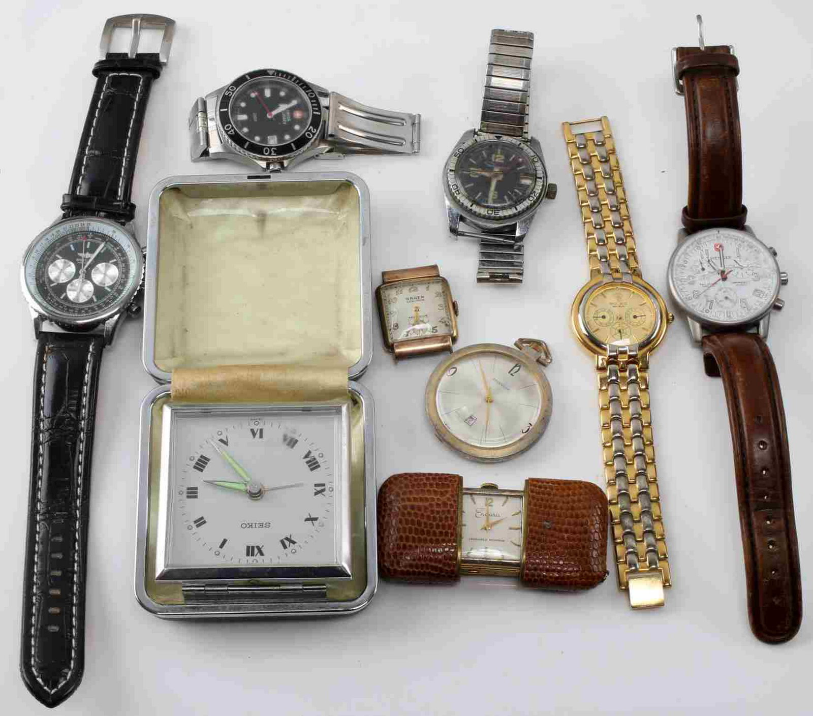 WATCH LOT MIXTURE OF WORKING AND NON PARTS: Variety of makers including repro rolecks. The Breitling is very convincing and it works but is repro. The winding watches and clocks start but need servicing.