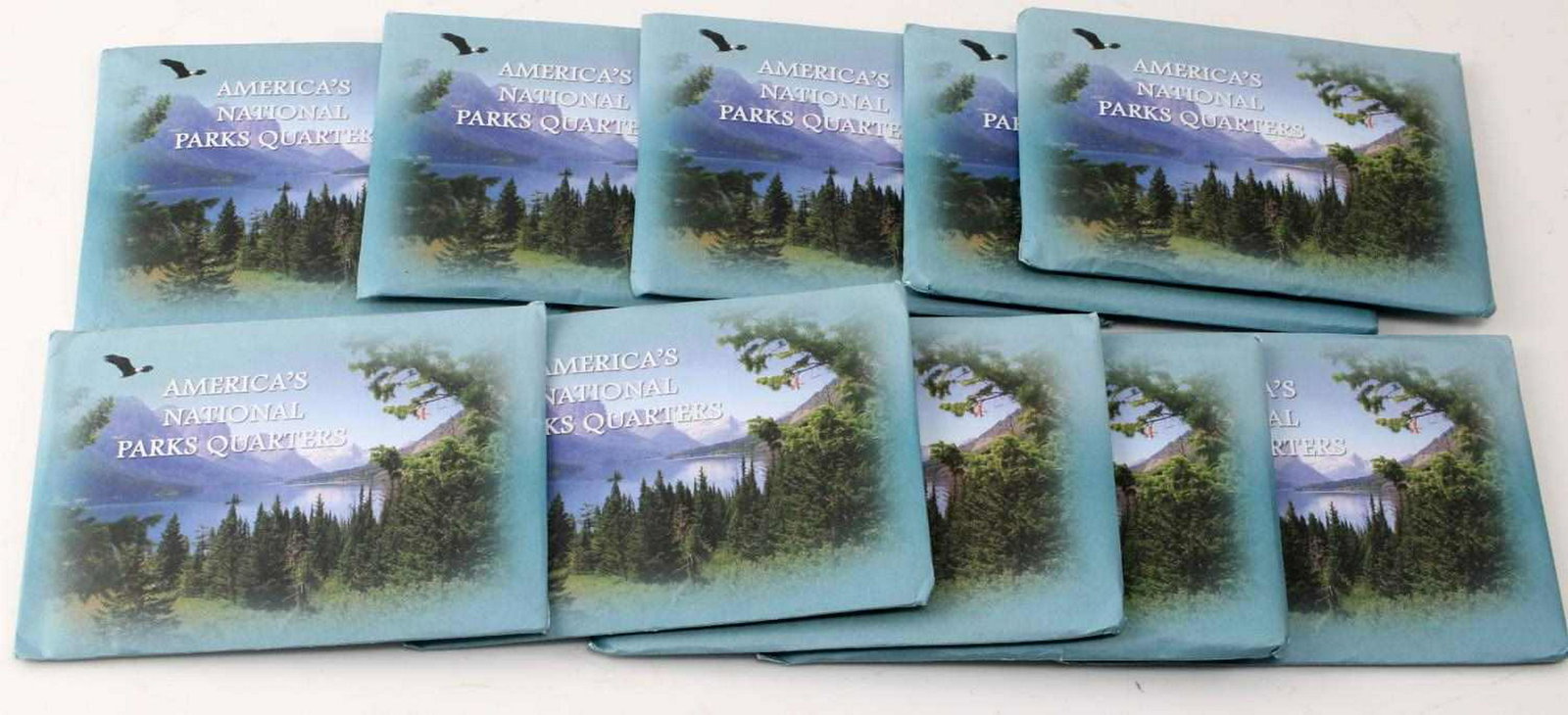 MINT US NATIONAL PARK QUARTER LOT OF 50: 2010 First Commemorative Mint Inc. National Park Quarters. Includes Philadelphia, Denver, Colorized, 24k Gold Plated, and 24k Gold Plated Hologram. Mint, in packaging, and includes COA. $12.50 in face