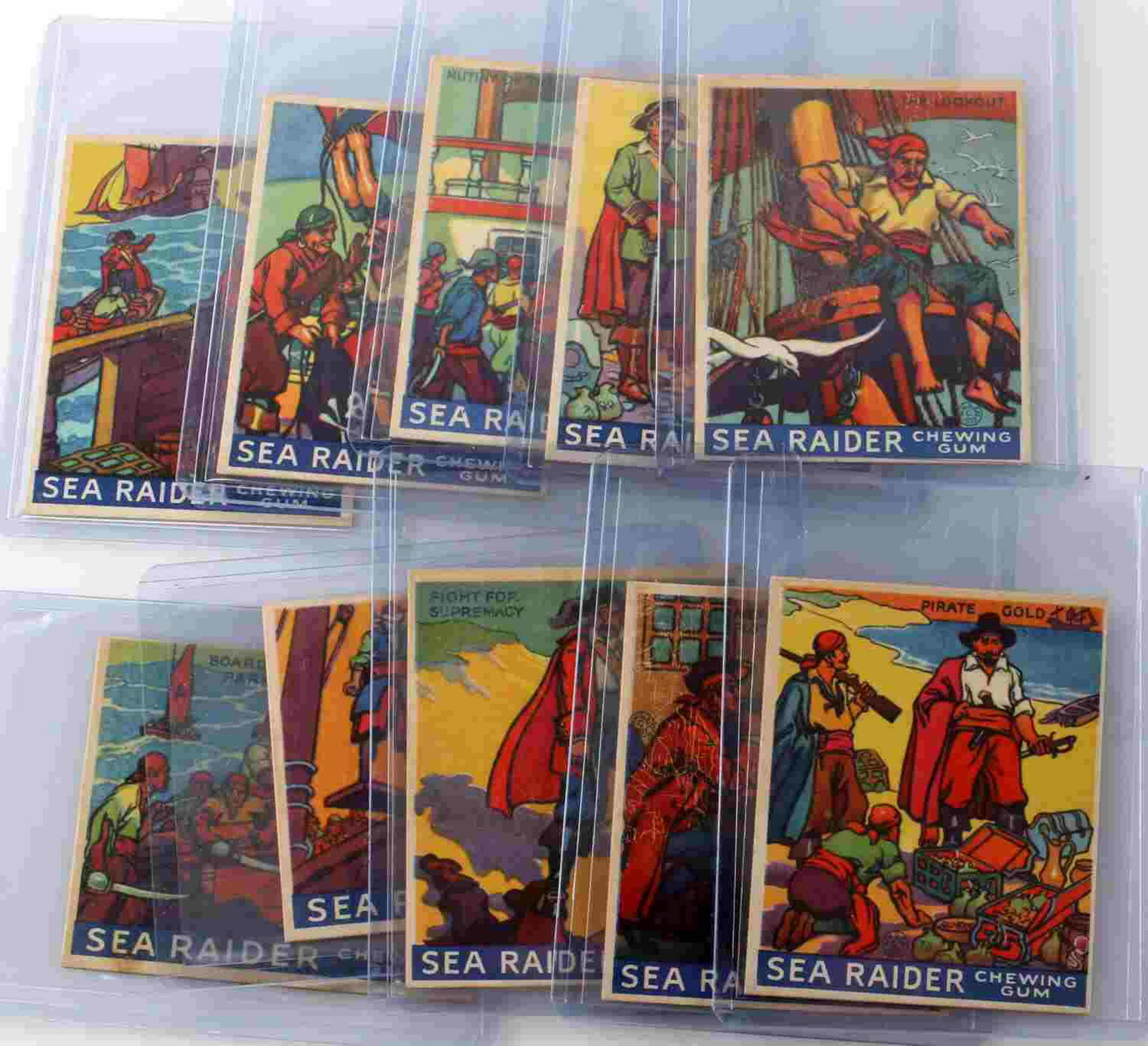 1933 R124 SEA RAIDER CHEWING GUM CARD LOT OF TEN: Lot contains 10 Sea Raider chewing gum cards. Includes Pirate Gold, Avery Discussing Plot, Fight for Supremacy, The Lookout, Extorting Tribute, Mutiny of the Crew, Walking the Plank, Boarding Party, F