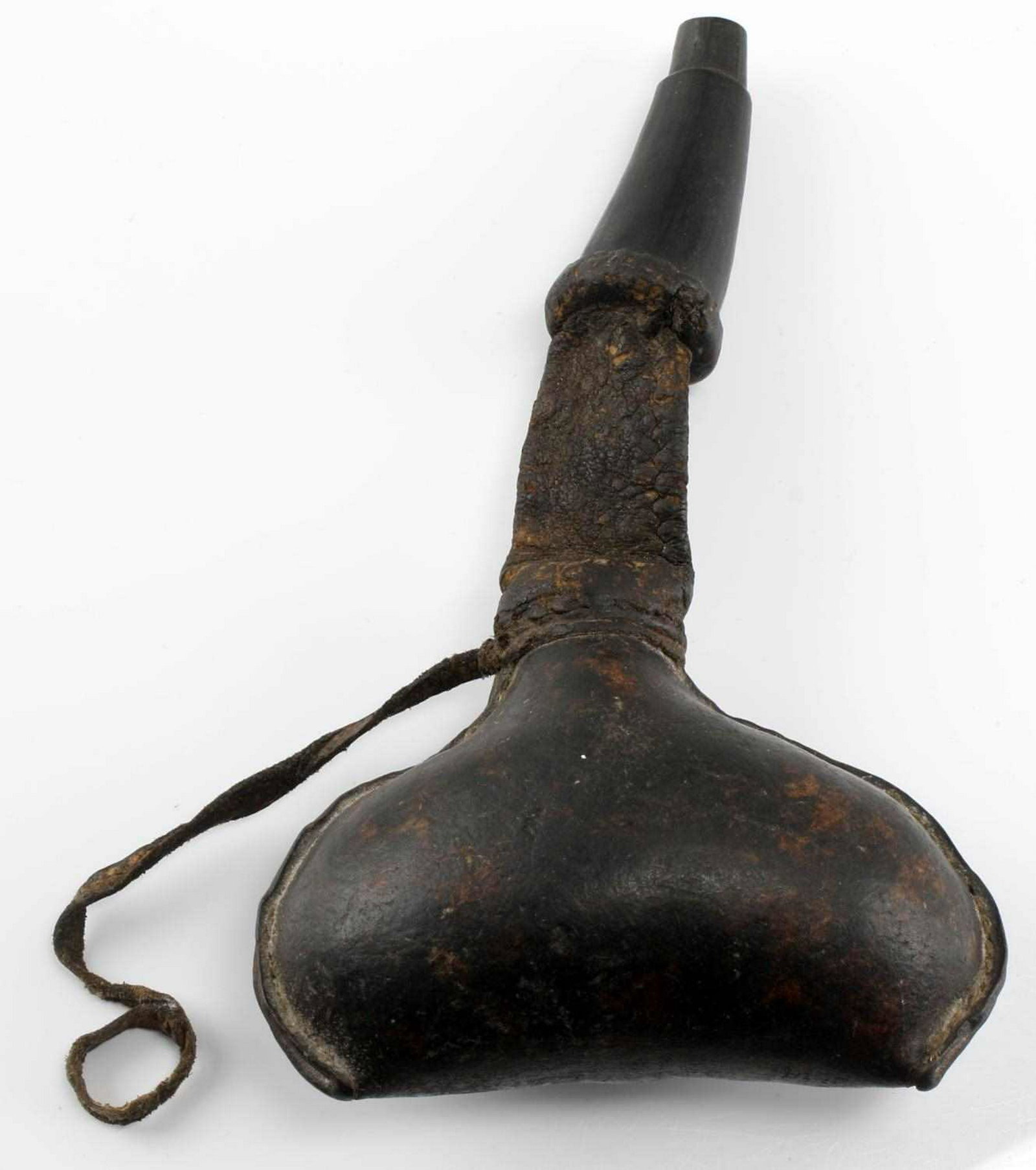 ANTIQUE BEDOUIN CAMEL SCROTUM POWDER FLASK: Has horn spout, leather neck, unusual style, measures 8 inches.