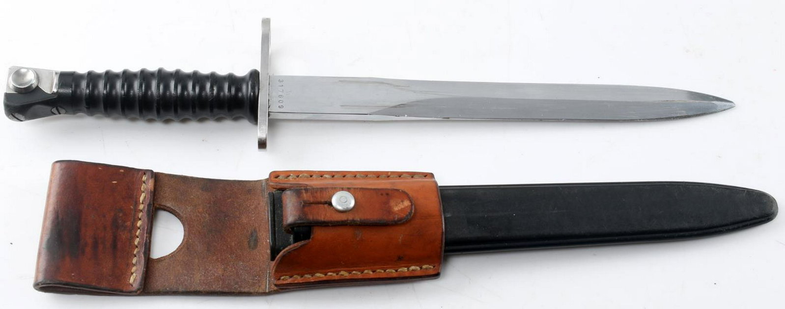 COLD WAR SWISS STGW 57 BATTLE RIFLE BAYONET: Bayonet for a Swiss Cold War era Stgw 57 battle rifle. Includes scabbard and leather frog. In very good condition. Serial number "W317609". Back of frog is marked "Ernst Kunz 83 Fehraltorf". In very g