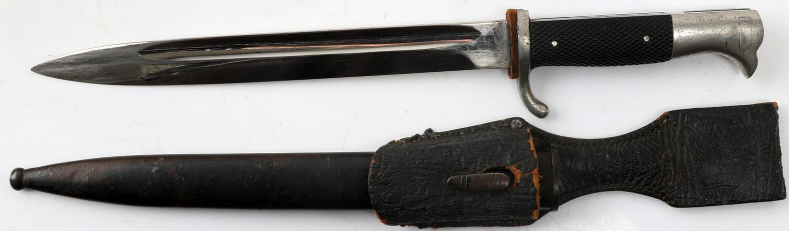 WWII GERMAN THIRD REICH WKC DRESS BAYONET: German dress bayonet with a WKC Solingen maker mark on the ricasso. Leather frog which has some wear and age cracking. Slight puckering of the nickel finish, and minor wear of the paint on the scabbar