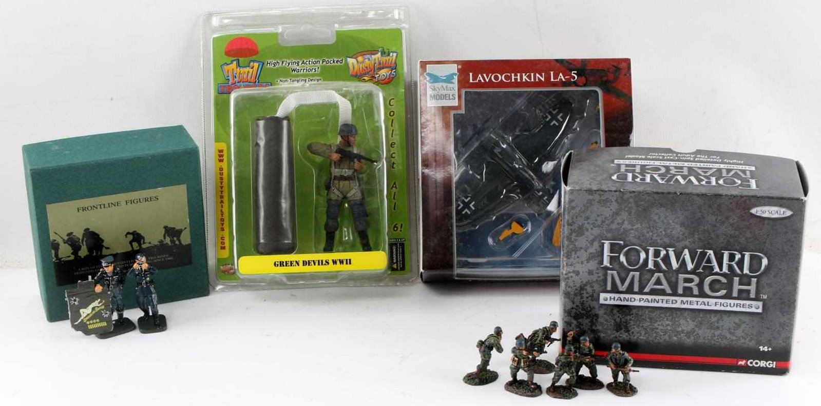 WWII GERMAN MODEL FIGURE & AIRPLANE LOT OF 4: This lot includes 1 Corgi "Forward March" Fallschirmjager set, 1 Frontline Figures Luftwaffe pilot with part of B-17 bomber and photographer, 1 Dusty Trails "Green Devils" Fallschirmjager paratrooping
