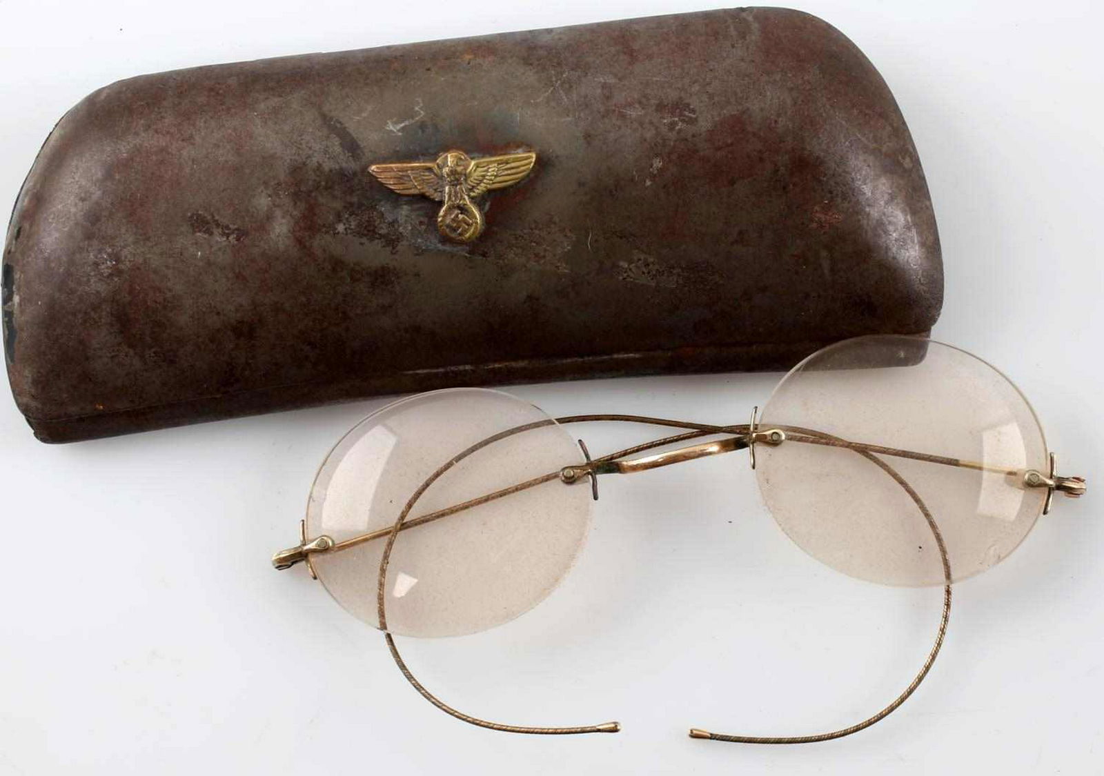 WWII GERMAN THIRD REICH NSDAP EYE GLASSES: German NSDAP member's eye glasses and case. Case has affixed Reichsadler on exterior top. Good overall. Heavy patina present. Glasses show wear and aging. Unauthenticated; sold as is. This lot has a r