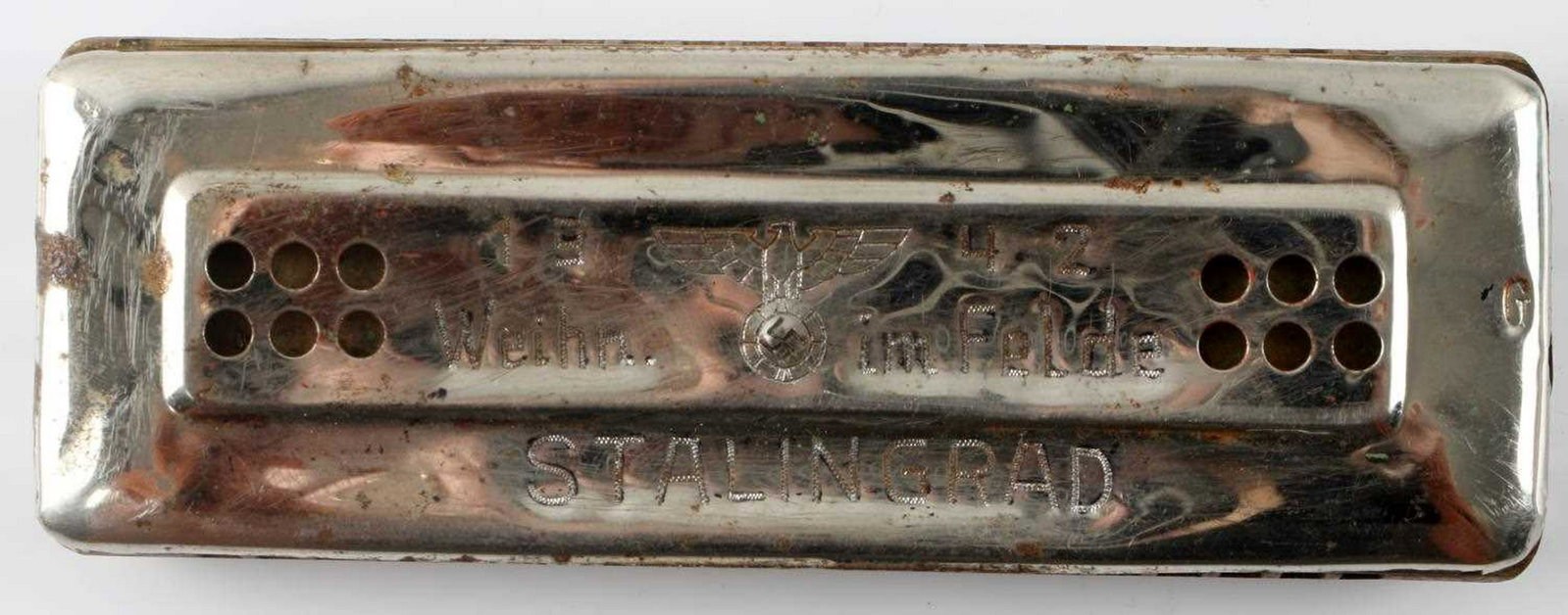 WWII GERMAN STALINGRAD TRENCH ART HARMONICA: Harmonica with an engraving which appears to be trench art made in the field in or around Stalingrad in 1942. In very good condition. Unauthenticated/Sold 'as is' This lot has a reserve.