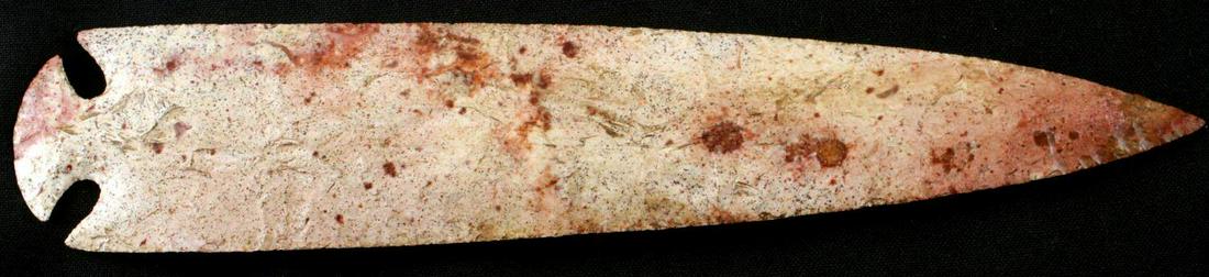 LARGE ST CHARLES ARROWHEAD POINT PINK CHERT: Excellent collateral flaking, corner-notched point with a dovetail base. Edges are sharp to touch. Somewhat worn patina. Measures 10 inches long. Very good condition.