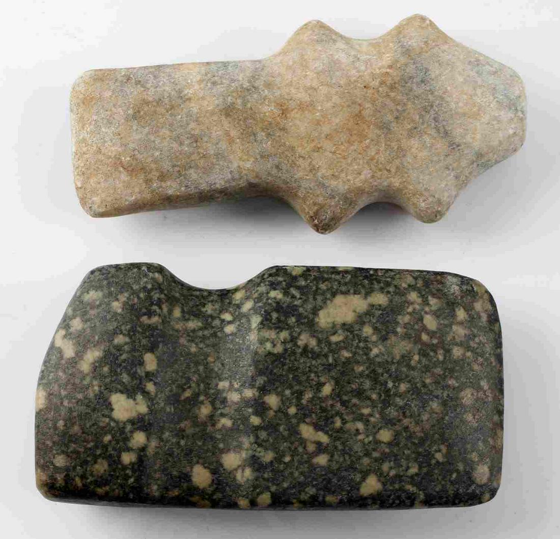 NATIVE AMERICAN CARVED STONE AXE HEAD LOT OF TWO: Native American stone axe head lot of two. Both measure about 5 inches in length. Both in very good condition.