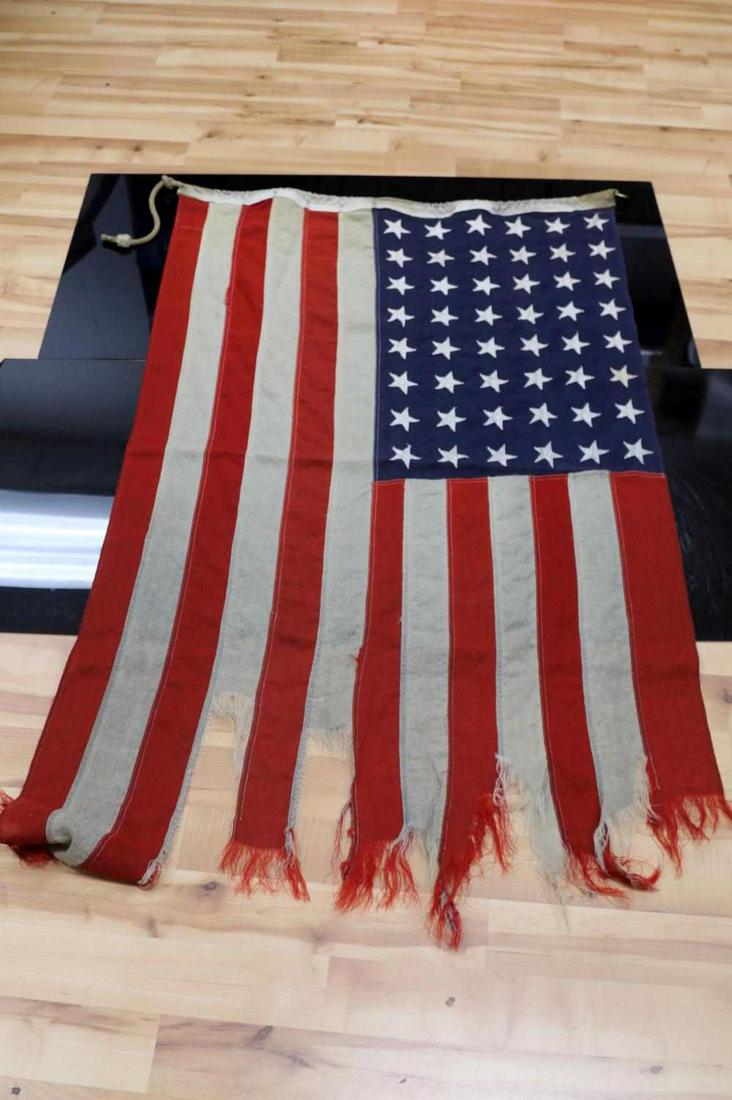 EARL JOHNSON NORTHWIND SHIPS FLAG & SIGNAL: Flag and signal from USCGC Norhtwind. Recovered by Earl Johnson after Operation Deepfreeze II, who also recovered items from the Scot and Shackleton camps. Signal measures 10.75 inches by 10.25 inches