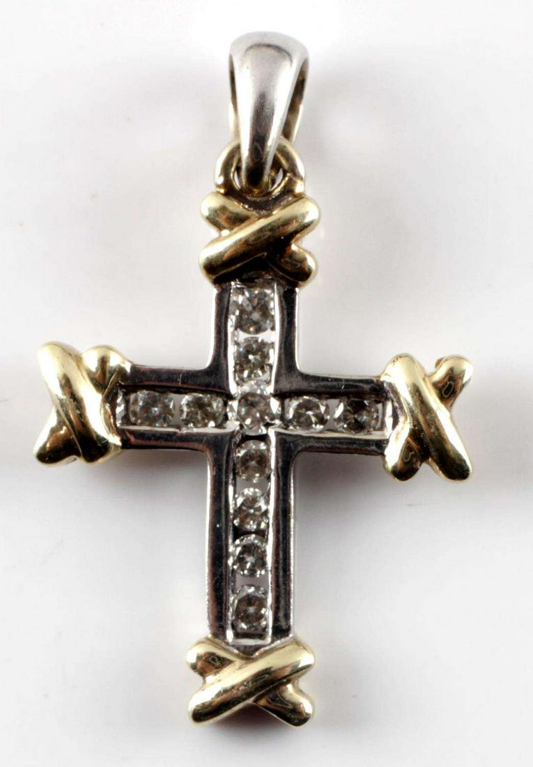 DAVID YURMAN 18K GOLD & DIAMOND CROSS PENDANT: 18k white gold pendant with yellow gold cross over detail at each end. 11 round cut diamonds throughout cross. Center stone is 2 mm and radiating are 1.5 mm. Approximately .18 TCW. VS2-SI1 clarity and