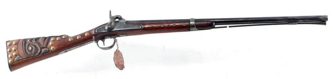 PLAINS INDIAN MODEL 1842 SPRINGFIELD CARBINE: A Model 1842 Springfield of carbine length with maker on plate as Harpers Ferry 1847. Stock has been decorated, presumably by Plains Indians at a later date, with brass studs and an eagle design carve