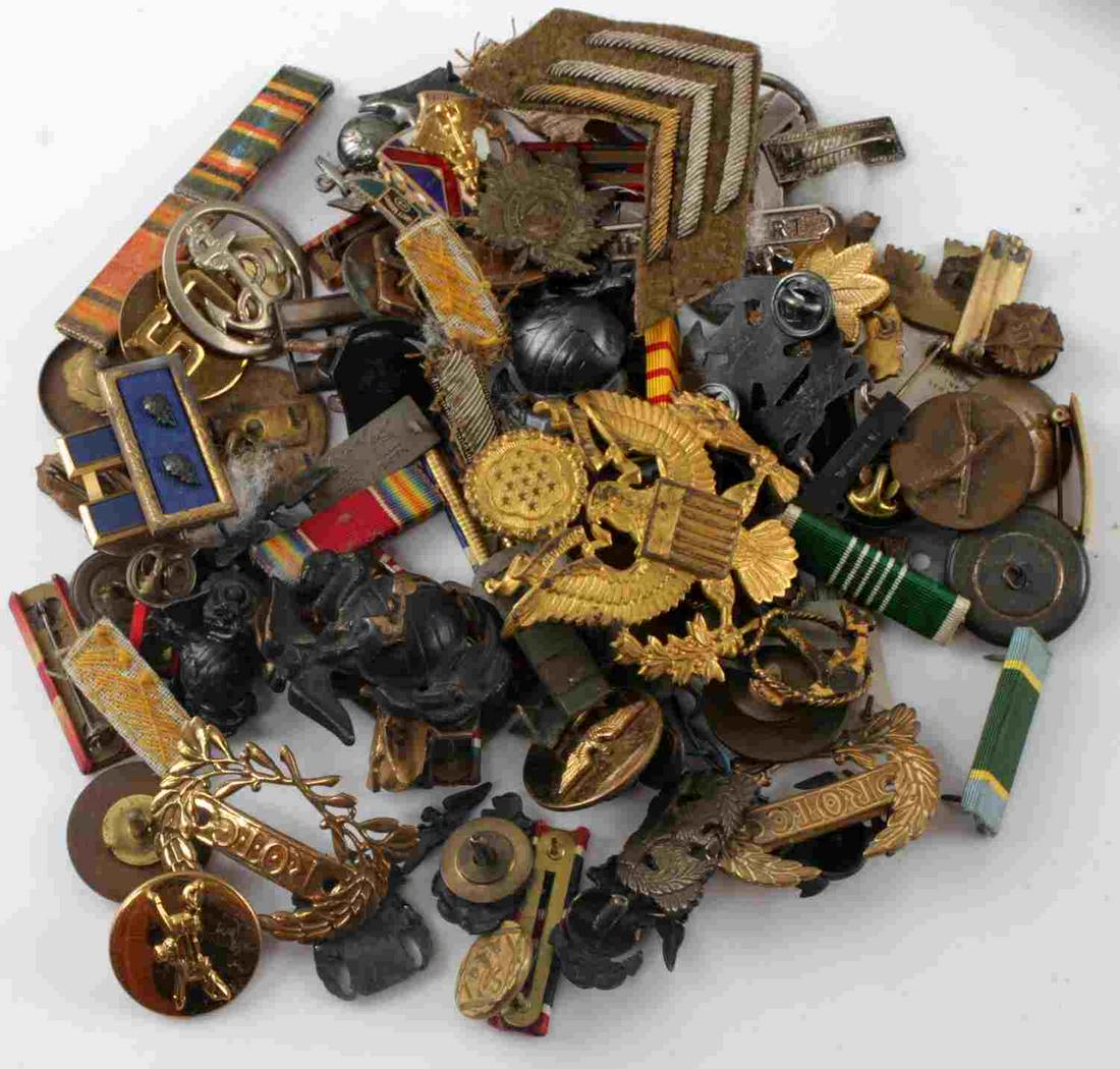 WWI WWII TO VIETNAM INSIGNIA LOT SOME SCARCE: Includes a Motor Transport Corp WWI disc, Victorian Boer War Queens own Rifles collar dog, large Cuba Marine visor EGA, cadet collar collar pans, WWI Imperial German Naval button, and much more, a wor