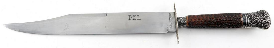 IXL G WOSTENHOLM & SON SHEFFIELD BOWIE KNIFE: Large Bowie knife with maker on the blade "IXL G. Wostenholm & Son Washington Works Sheffield". Has several hallmarks on pommel. Has textured wooden grip. Measures 17.5 inches in length. In very good 