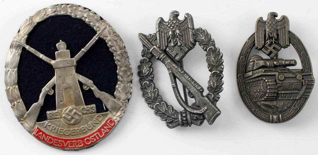 WWII GERMAN THIRD REICH ASSAULT BADGE & SHIELD LOT: Lot includes 1 Panzer assault badge, 1 Infantry assault badge, and 1 Landesverb-Ostland shield. Reverse of infantry badge marked S.H. u Co 41." Panzer assault reverse marked "AS" within triangle. Both