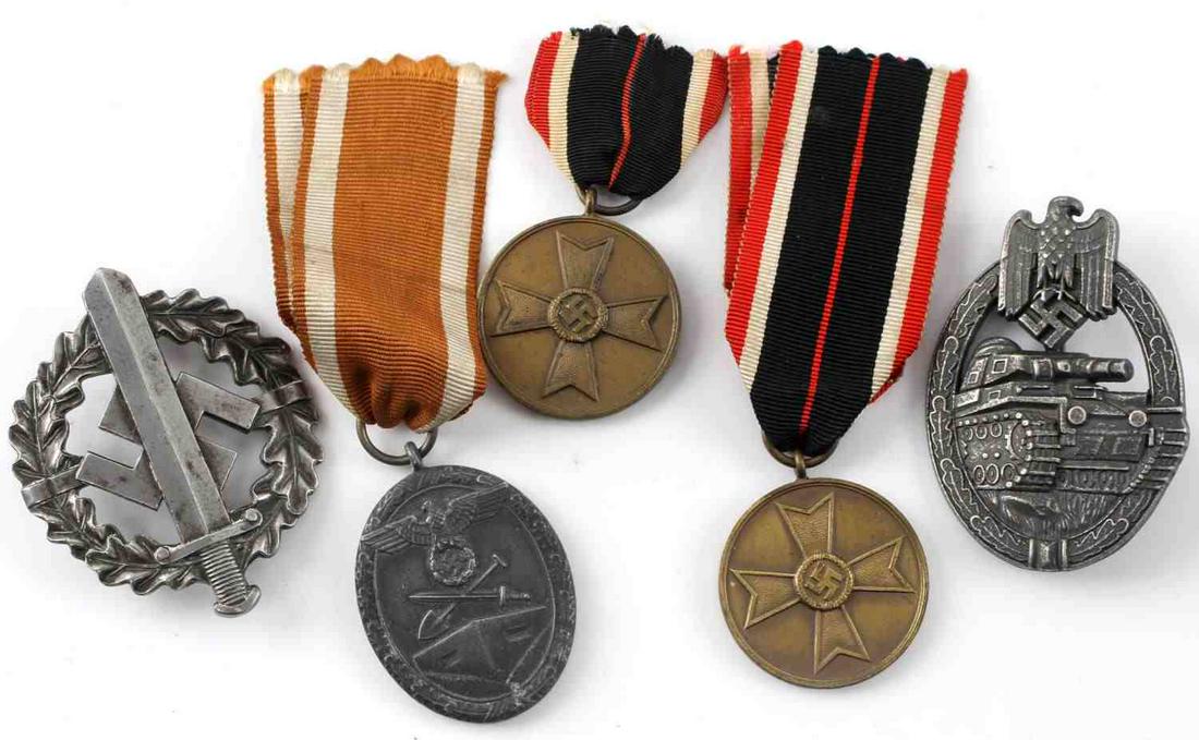 WWII GERMAN THIRD REICH BADGE & MEDAL LOT OF 5: This lot includes 1 German Panzer Assault badge, 1 German West Wall medal, 2 Kriegsverdienstkreuz medals, and 1 German SA sports badge. Badges are in good condition. 1 Kriegsverdienstkreuz medal has h