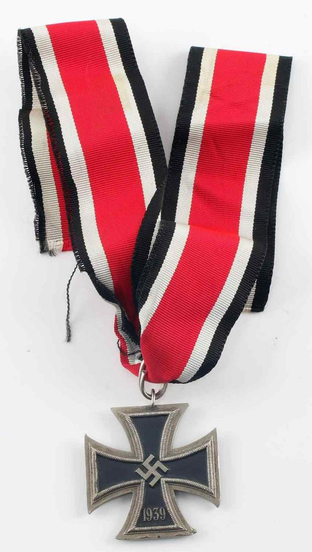 WWII GERMAN 3RD REICH KNIGHTS CROSS REPLICA MEDAL: Replica Knights Cross of the Iron Cross. Edges are slightly rounded and show some tool marks on the bottom arm. Non-magnetic core. Includes length of ribbon. In good condition.