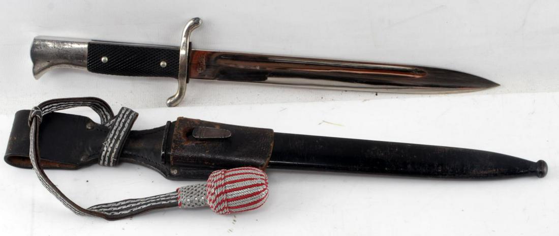 WWII GERMAN 3RD REICH FIRE POLICE BAYONET BY TIGER: German fire police bayonet by Tiger. Includes black scabbard, portepee, and frog. Maker marked "Tiger Solingen" on ricasso with Tiger motif on reverse side. Good condition overall. Some wear and paint