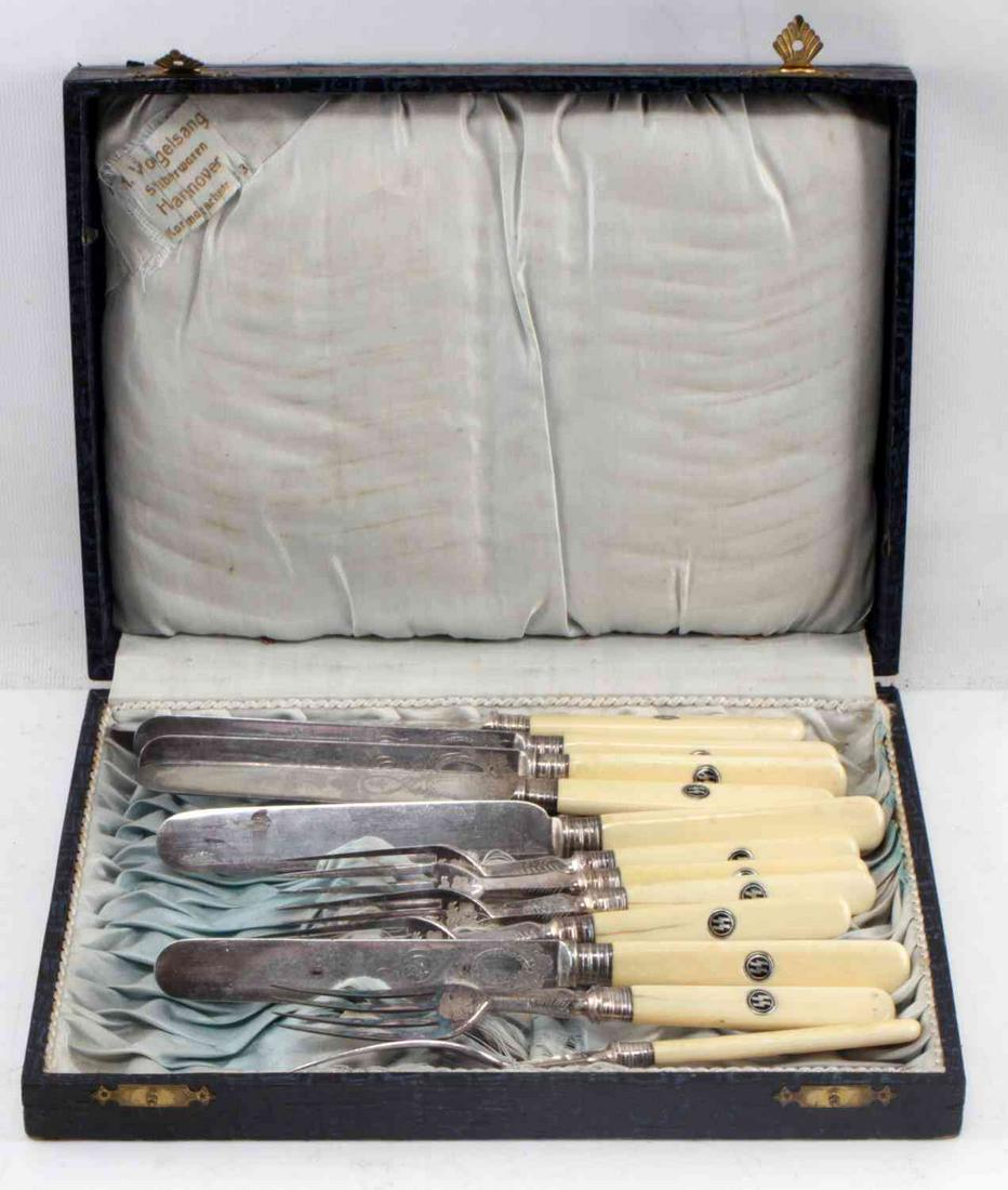 WWII GERMAN SS OFFICERS SILVERWARE LOT OF 12: German SS officer's silverware set from an officer's canteen. Pieces are 800 silver with bone handles. Handles have double S sig runes at their tops. Includes 6 forks and 6 knives. Each piece is ornat