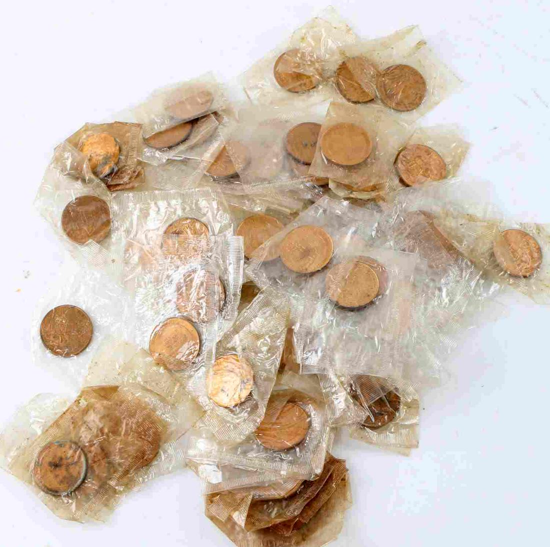 LOT OF 100 APOLLO XI 1969 SEALED TOKENS: 100 individually sealed Apollo XI tokens. Apollo XI Armstrong Aldrin Collins to front side and Apollo XI Mission: Manned Lunar Landing Rocket Saturn V July 16-24, 1969 to reverse. Measure 25mm in diam