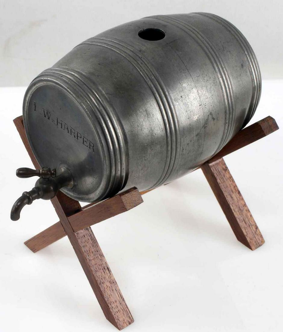 ANTIQUE PEWTER I.W. HARPER WHISKEY BAR DECANTER: Missing cork, otherwise works fine, on wood stand, measures 3 3/4 by 2 cask only not stand.