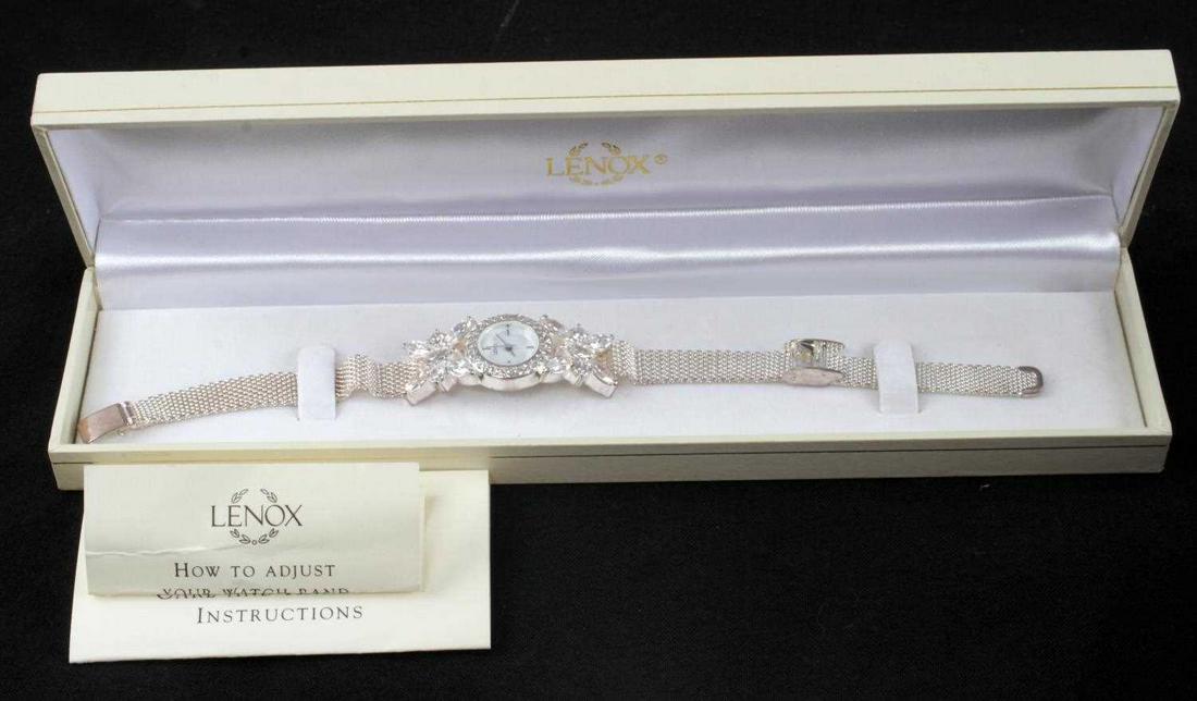 STERLING SILVER & CRYSTAL LENOX BUTTERFLY WATCH: Lenox sterling silver mesh watch. Crystal at top and bottom of watch face in butterfly like pattern. Measures 9 inches total. Very good working condition.