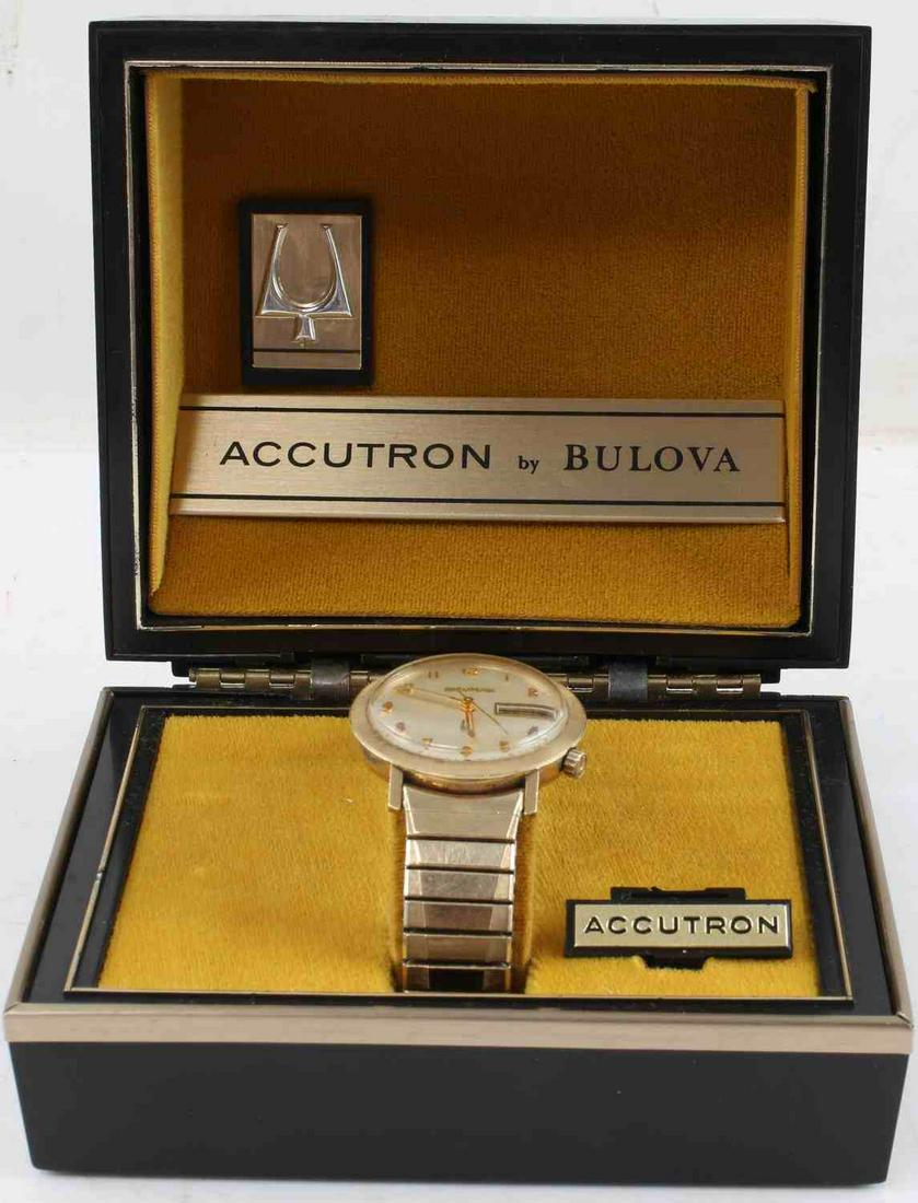 VINTAGE BULOVA ACCUTRON 14K GF WATCH IN BOX: Bulova Accutron wrist watch. Has a 14k gold filled case and the top caps of the band are 10k gold fill. Does not initiate movement on its own. In presentation and exterior cardboard box. In good condi