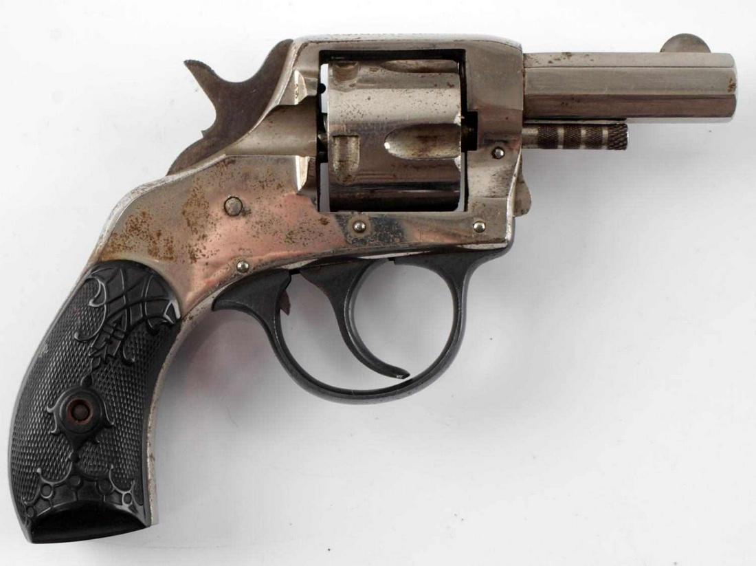 H&R YOUNG AMERICAN DA 5 SHOT REVOLVER .32 CF: Nickel finish with scattered oxidation, bakelite grips, Young American marked to top of frame, maker and caliber marked to 2 inch octagon barrel, good clear bore, serial no. to butt, double action wor