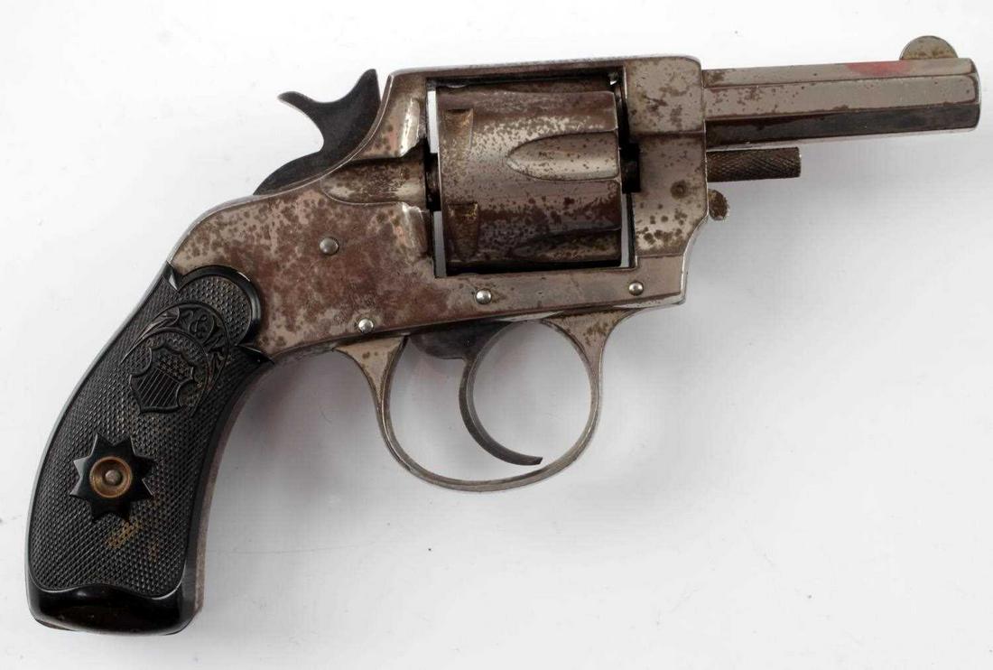 FOREHAND ARMS DA 6 SHOT REVOLVER .32 CENTERFIRE: Scattered patina, bakelite grips, maker and patent date June 2 1891 marked to top of frame, 2.5 inch octagon barrel has fair bore with minimal pitting, serial no. stamped to butt. Double action works.