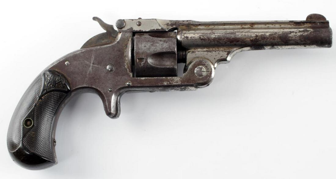 SMITH & WESSON MODEL 1.5 TOP BREAK REVOLVER .32: Scattered patina on nickel finish, maker and patent dates to top of 3.5 inch barrel with July 25 1871 as the last, fair bore, bakelite grips, single action works, overall good condition. Cannot ship i