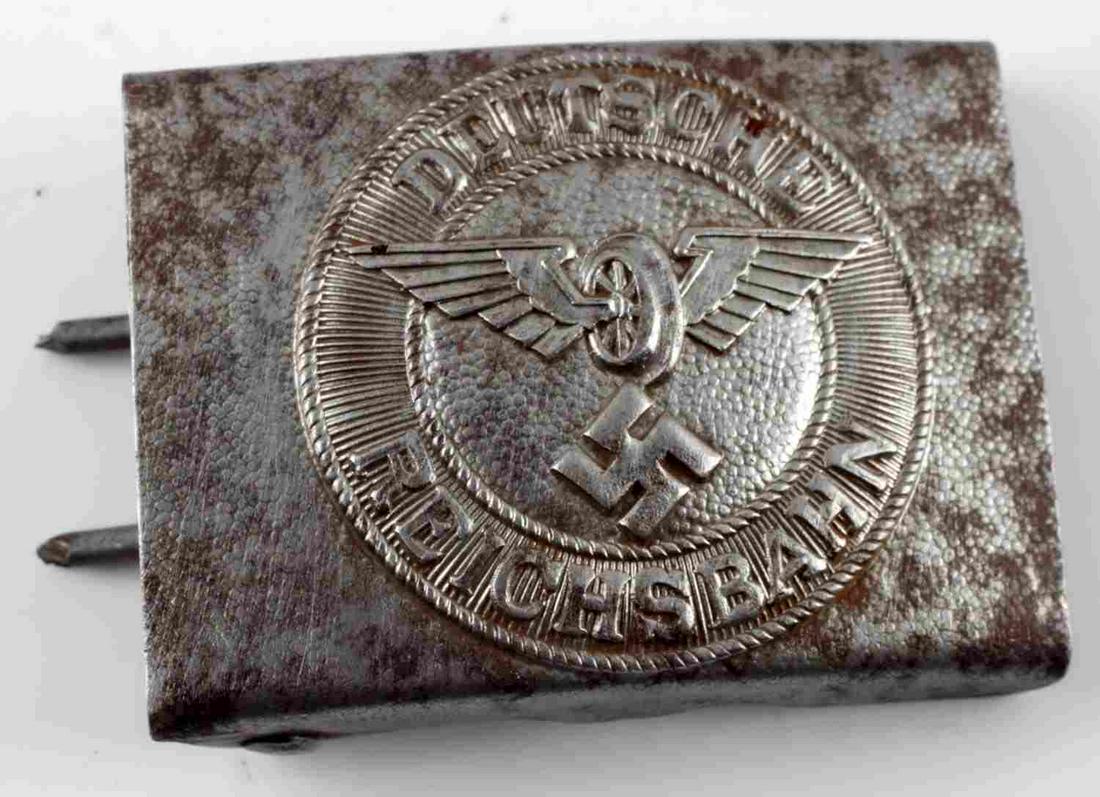 WWII THIRD REICH GERMAN DEUTSCHE BELT BUCKLE: Deutsche Reichsbahn with wings and swastika to front center in relief. Measures 2.5 inches wide. Scattered patina, good condition. Unauthenticated, sold as is.