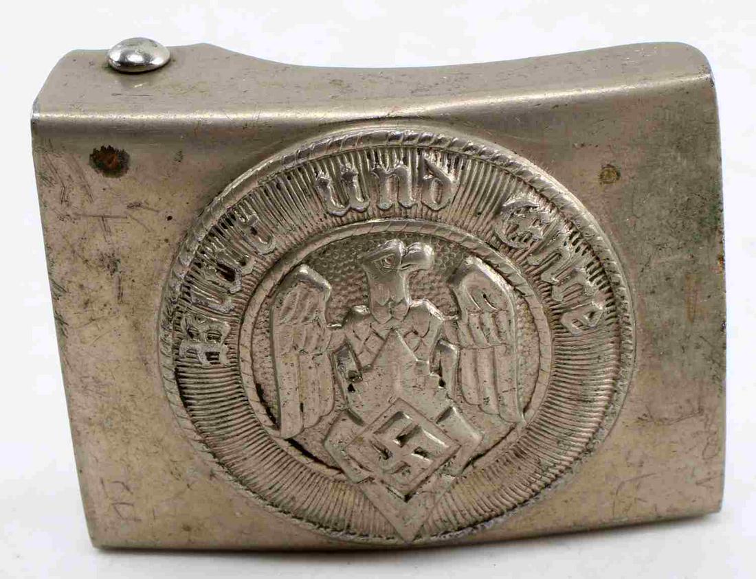 WWII GERMAN THIRD REICH HITLER YOUTH BELT BUCKLE: German Hitler Youth HJ belt buckle. Earlier steel version. In good condition with some slight detail loss and corrosion present. Faint "M/4/27" mark present on reverse.